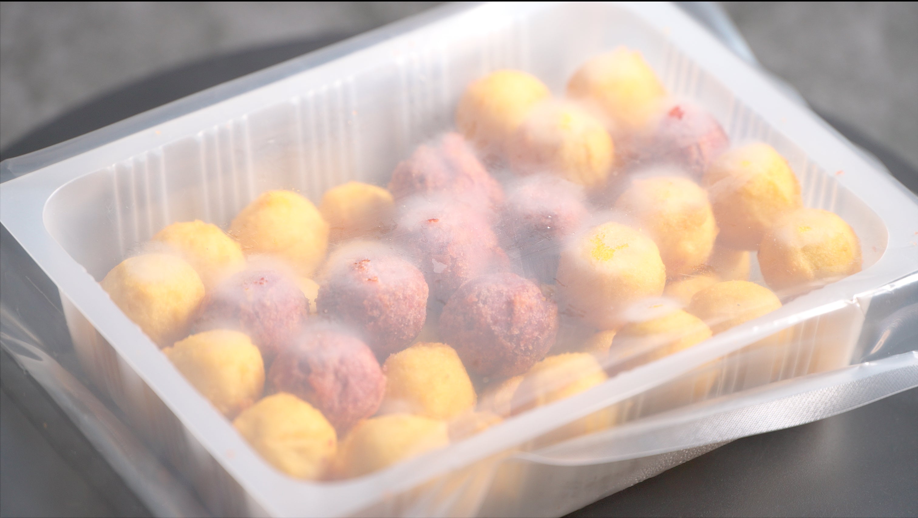 Vegan gluten-free sweet potato balls in protective packaging