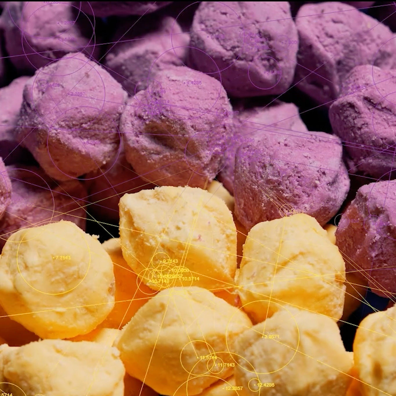 Close-up shot of frozen yellow and purple Lumo sweet potato balls prepared for waffle-maker cooking.