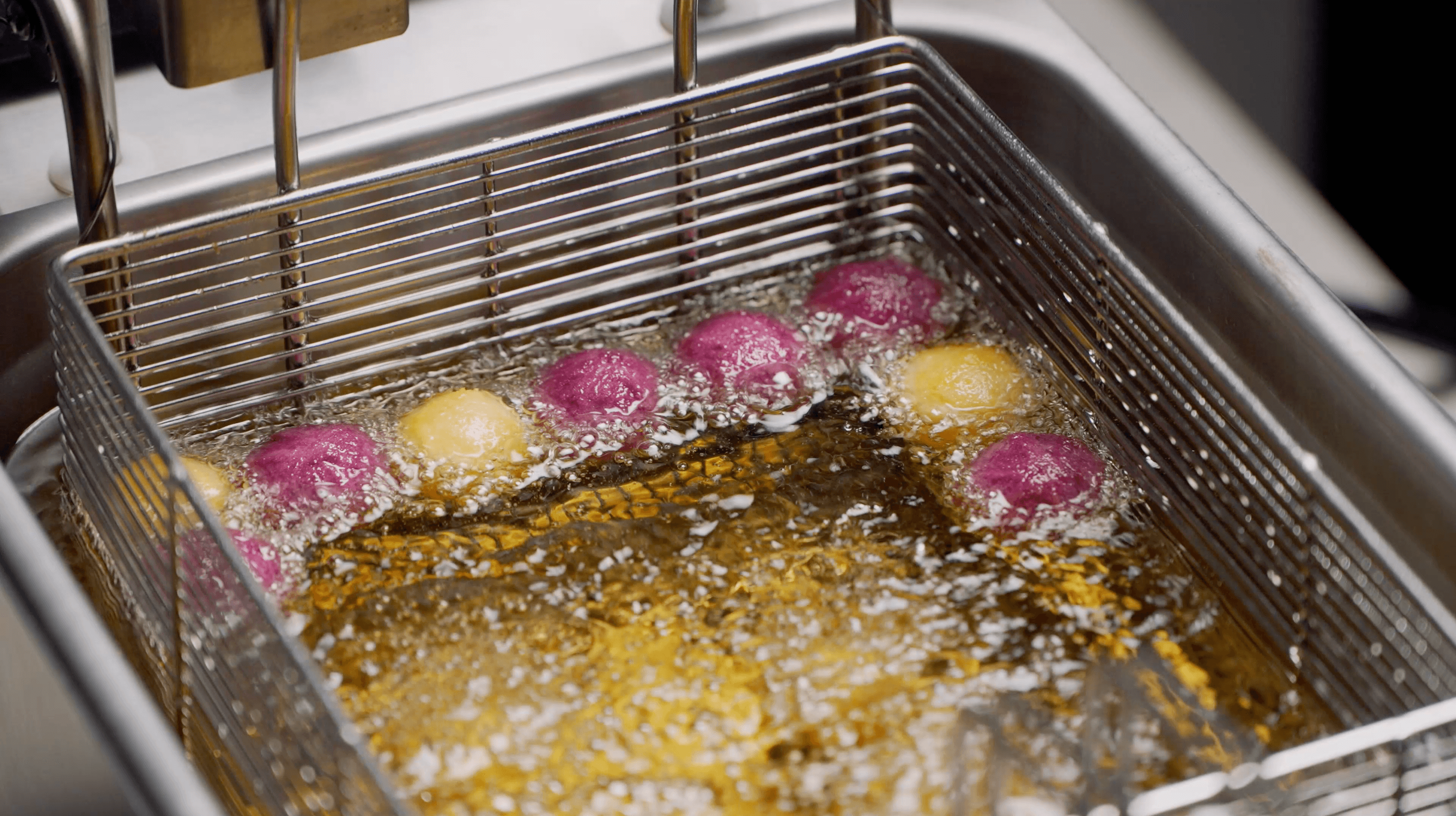 Lumo deep fryer basket frying sweet potato balls in hot oil
