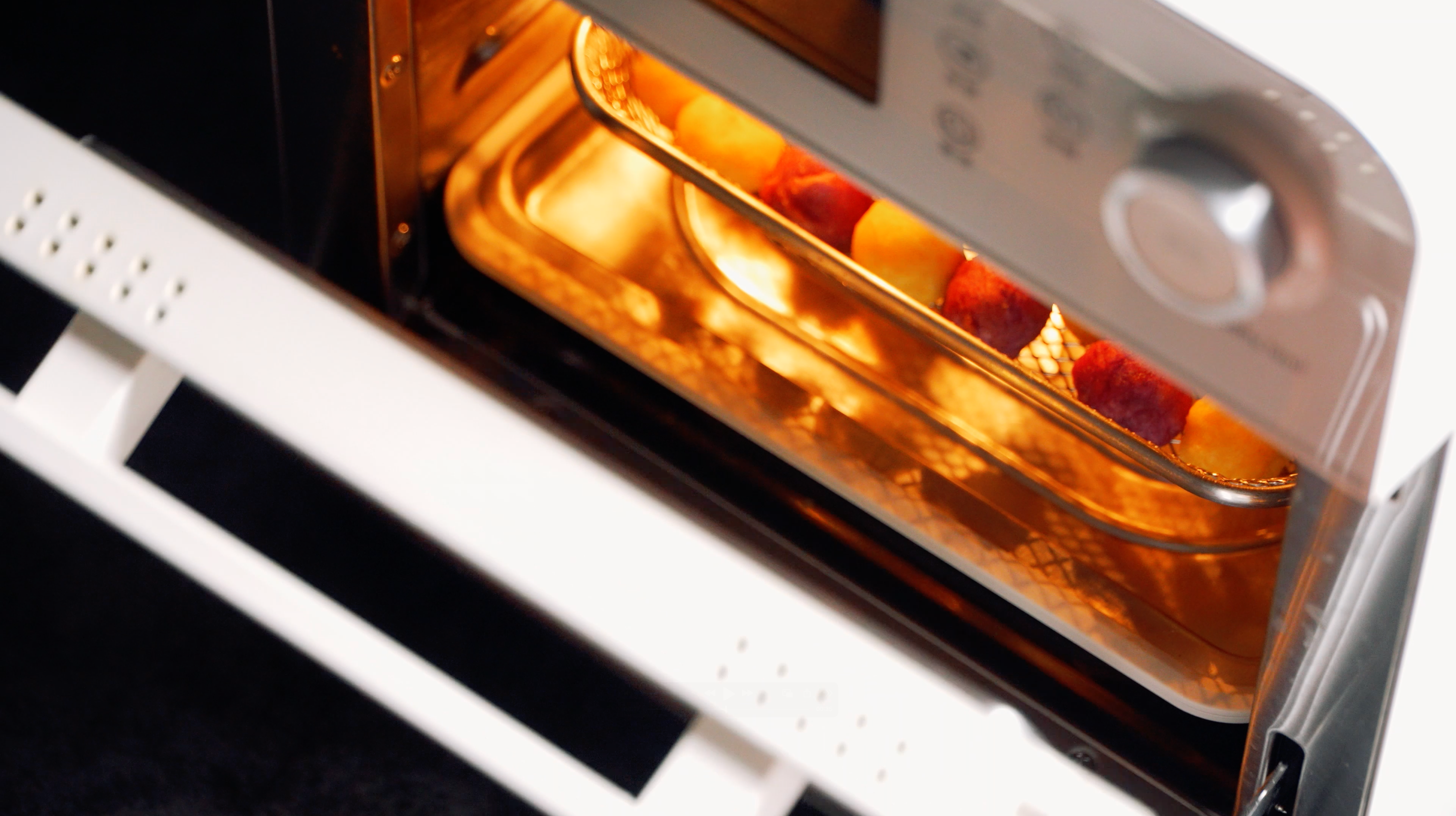 Lumo oven cooking – sweet potato balls baking on tray inside oven